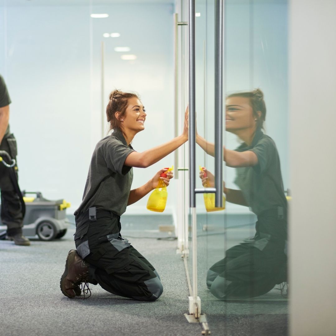 women cleaning door