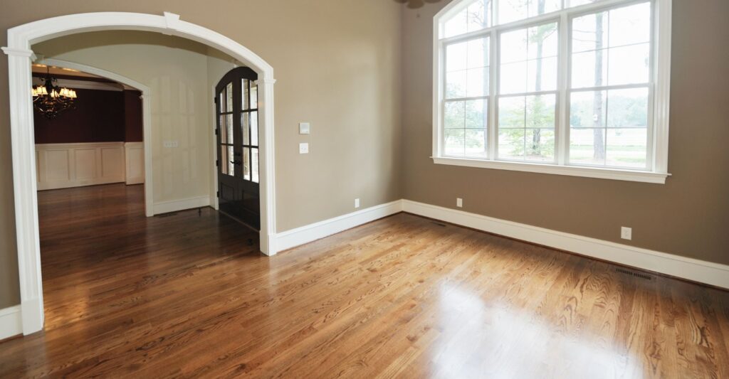 window reflecting on wood floor