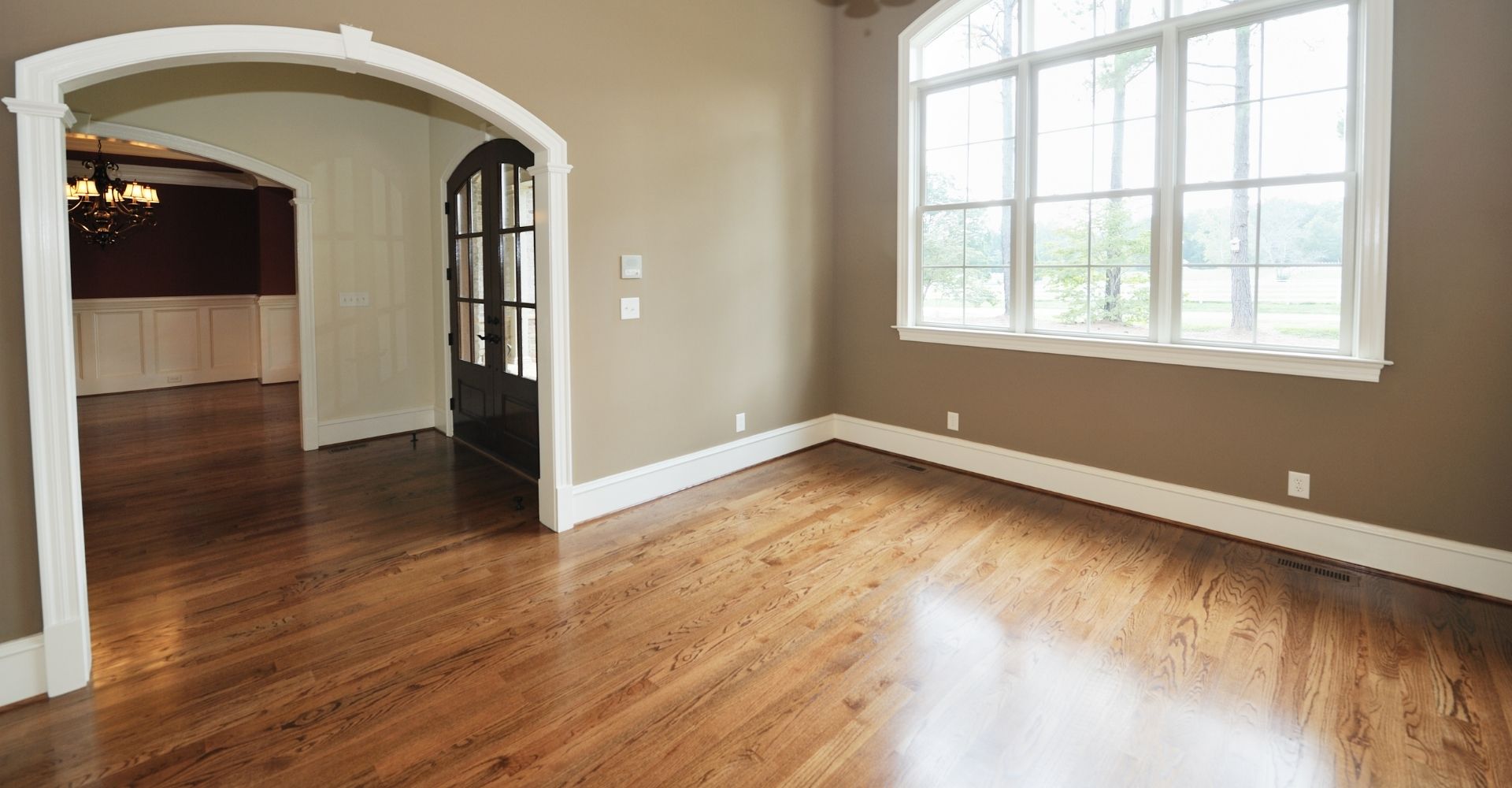 window reflecting on wood floor