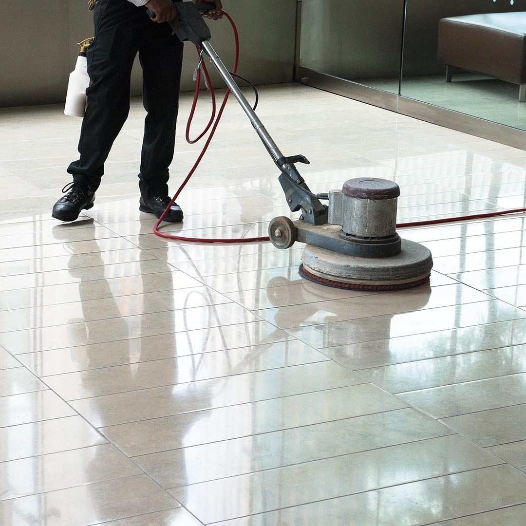 Person cleaning tile floors