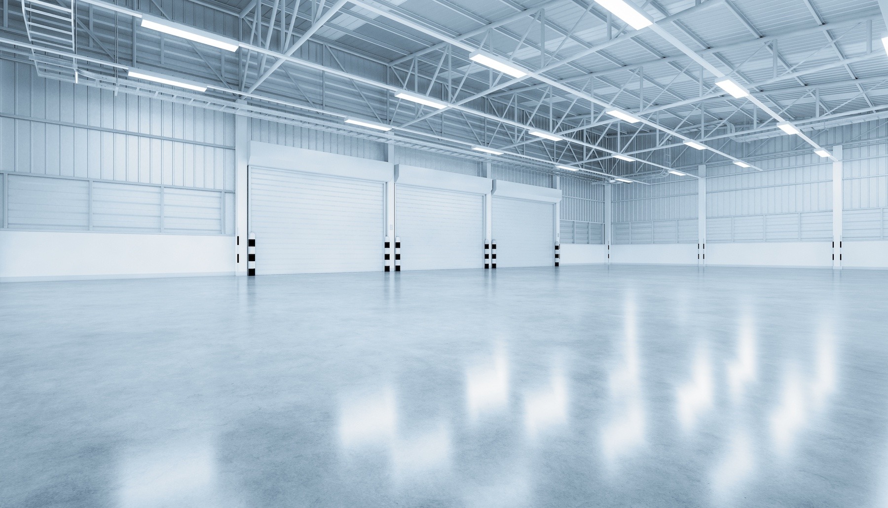 3d rendering of shutter door and concrete floor inside warehouse building for industrial background.